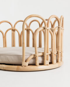 Flos rattan pet bed showcasing curved frame design