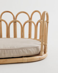 Flos rattan pet bed showcasing curved frame design